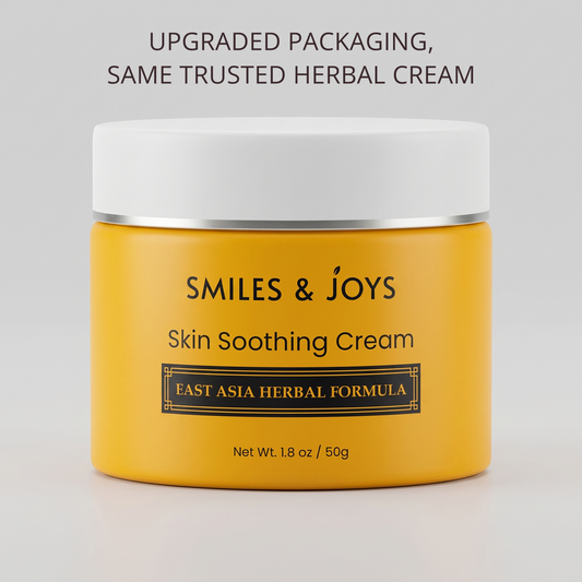 Yellow jar of 'Smiles & Joys' skin soothing cream with white lid on a light gray background.